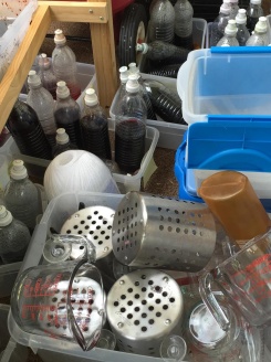 Dye bottles and measuring supplies wait for their turn to be cleaned up.
